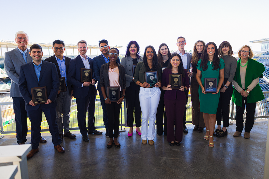 Baylor graduate students holding awards