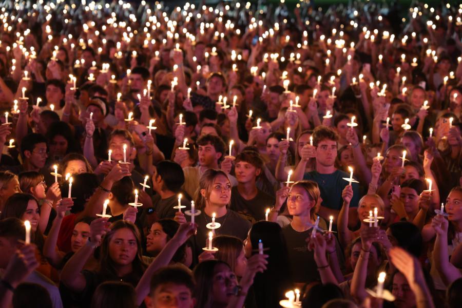 Students worshiping with candles at Baylor University