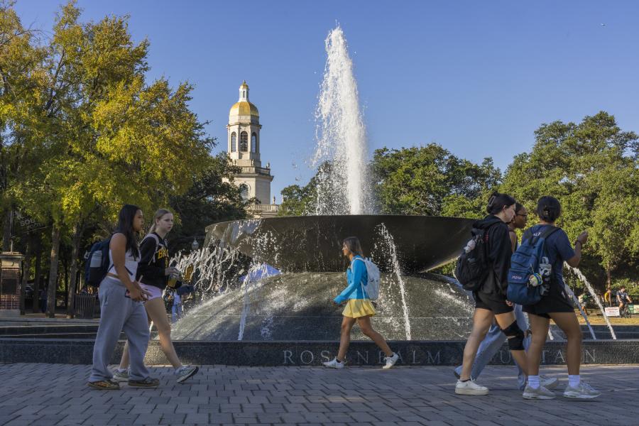Baylor students walking by the Rosenbalm Fountain on campus